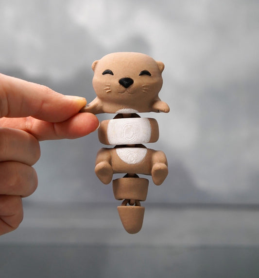 Otis, der flexible Otter – Händchenhaltender Otter-Kumpel